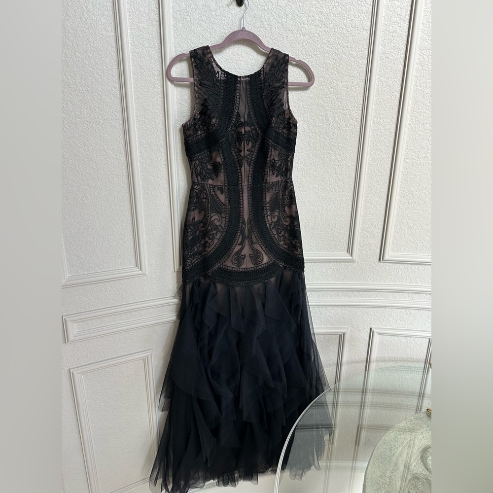 Black and neutral.  Only worn once evening gown. Light weight and elegant.